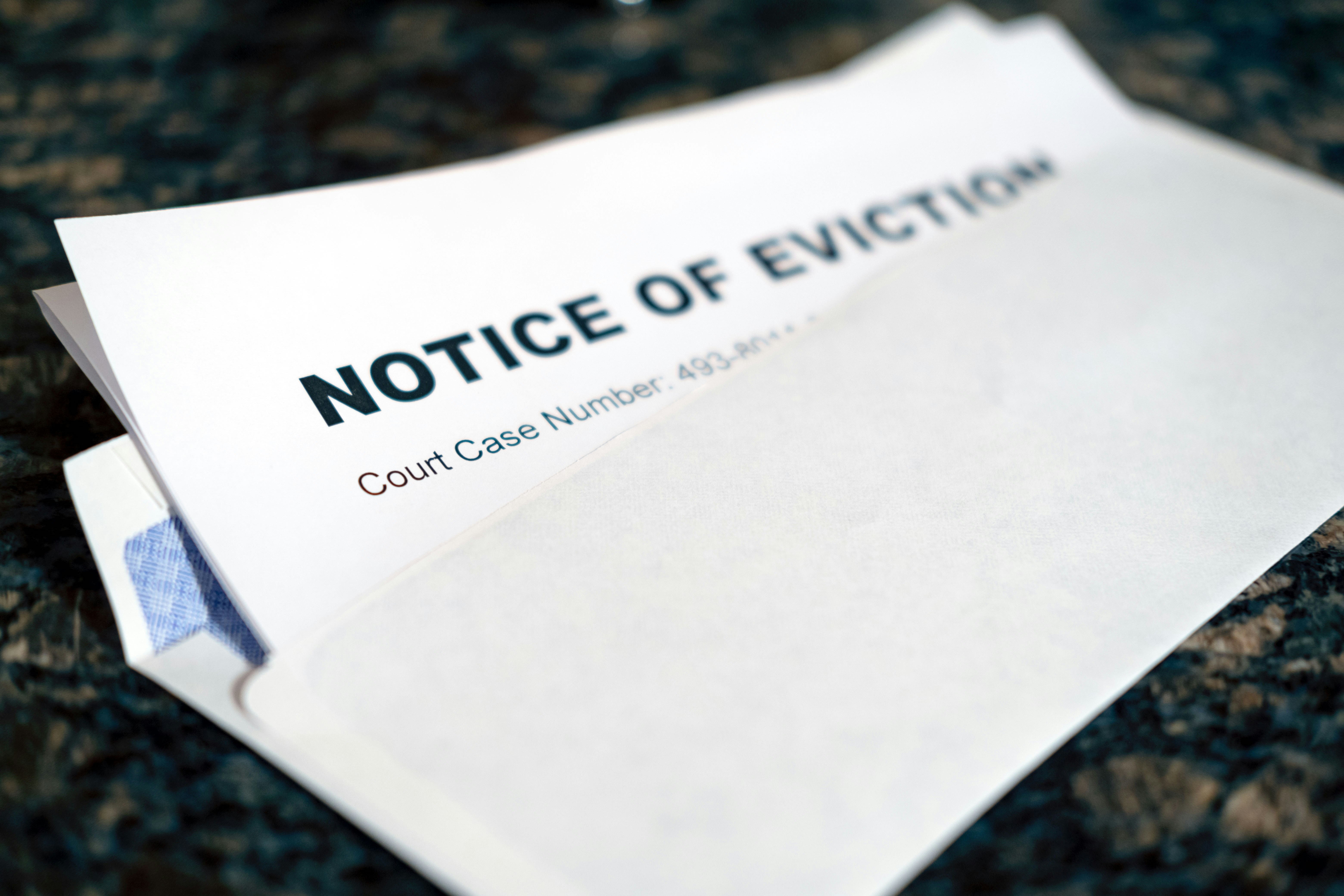 a letter in an envelope that says "notice of eviction". Photo by Allan Vega on Unsplash